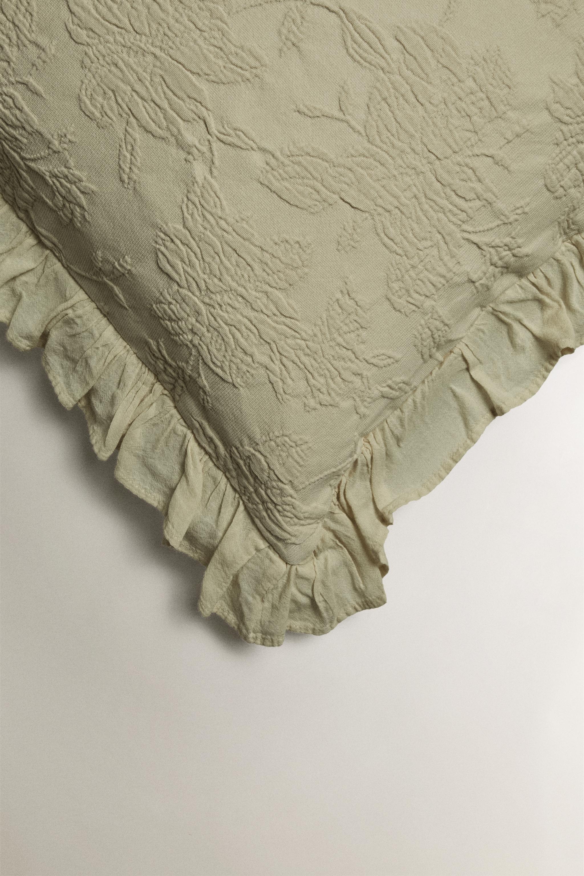 HOUSSE DE COUSSIN JACQUARD VOLANT